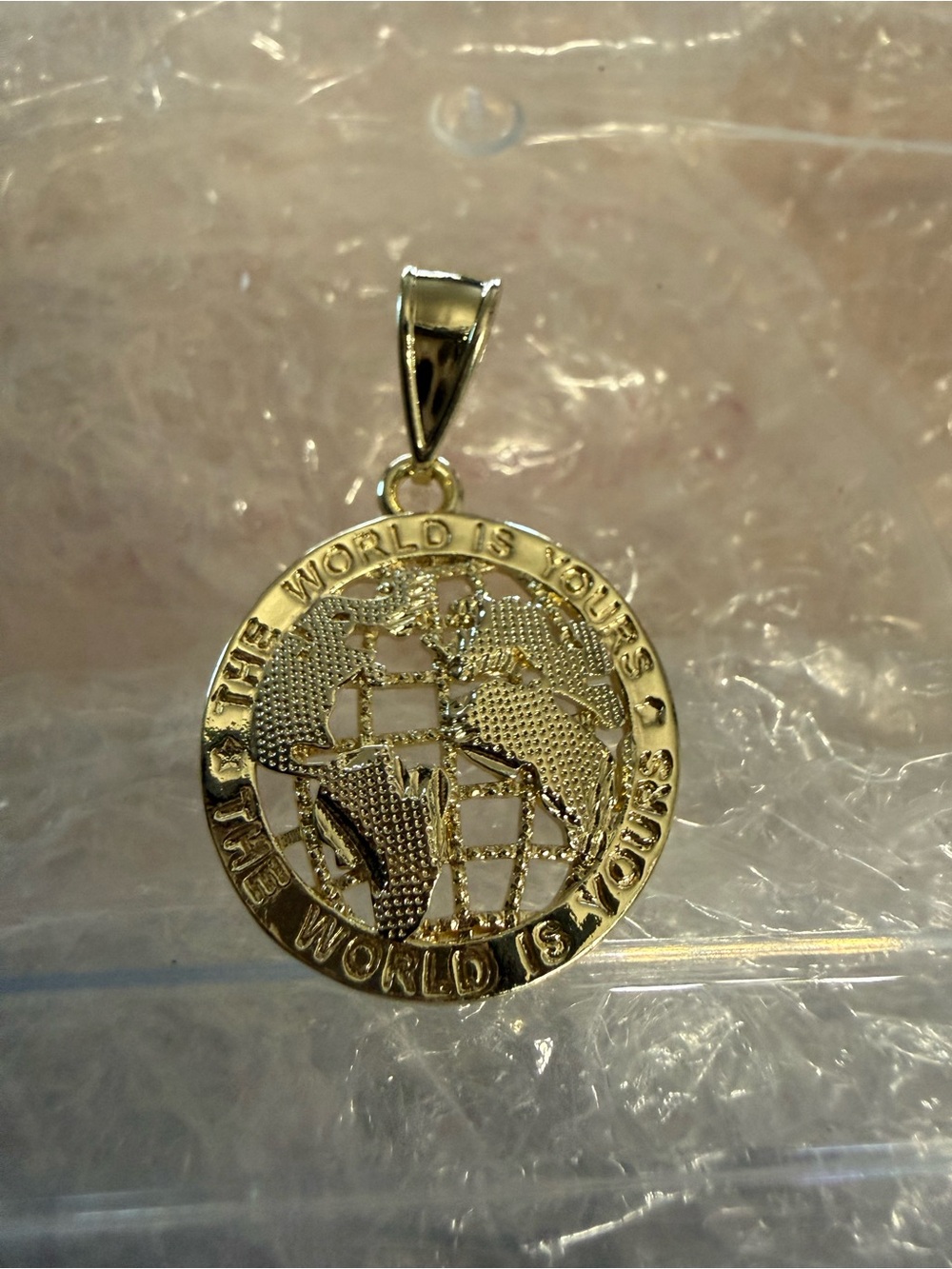 Gold-tone World Map Pendant - The World Is Yours